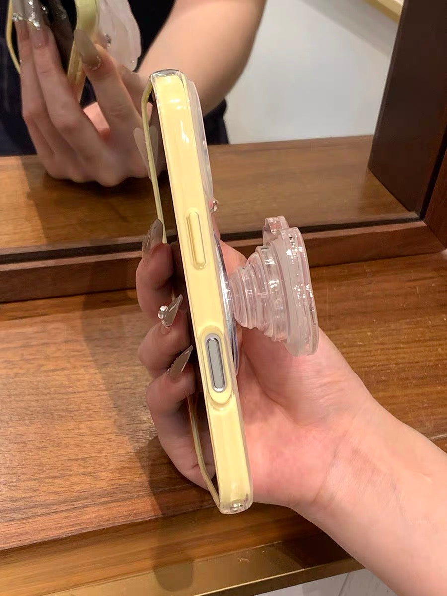 Phone case with yellow trim, kitten design, and built-in magnetic stand for daily use.