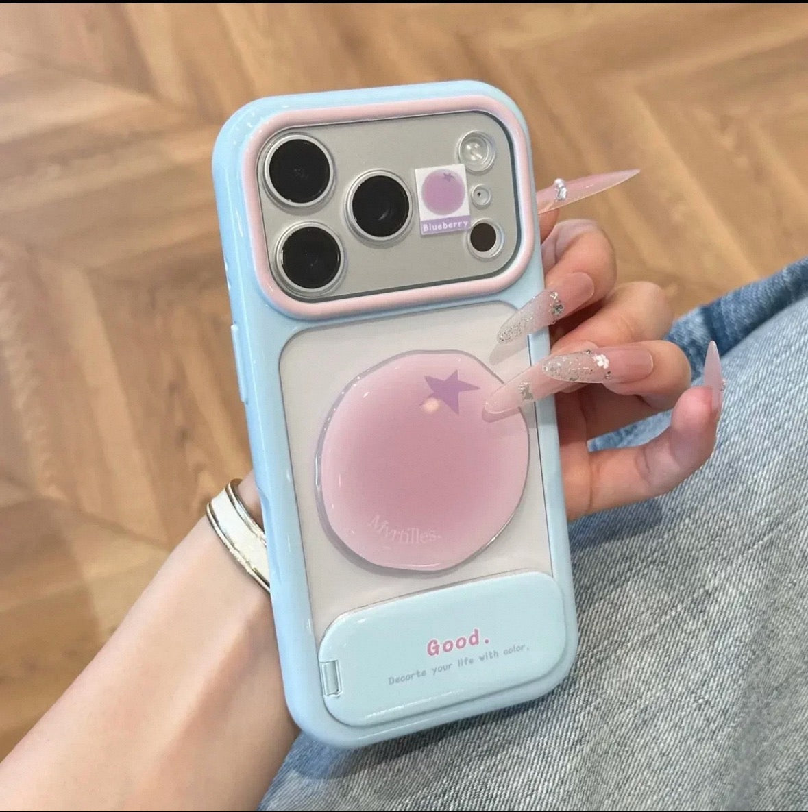 Phone case with a mirror stand and 3D fruit embellishments