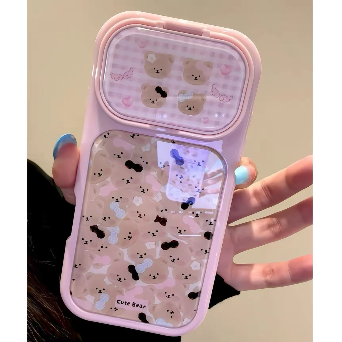 Flip-mirror phone case featuring a pink bow and an all-over teddy bear pattern.