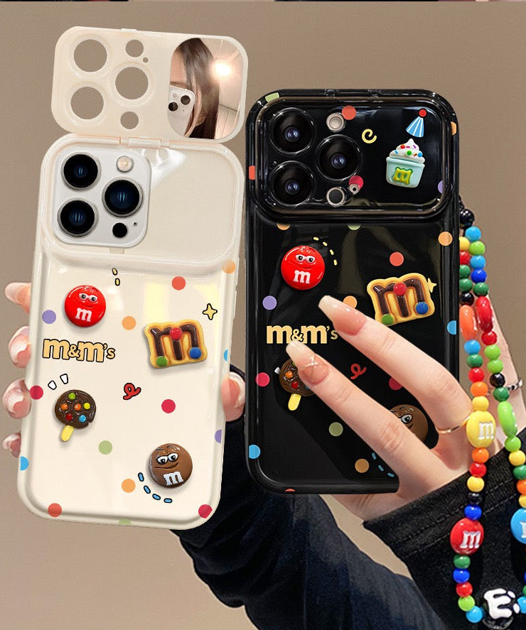 Polka-dot M&M character phone case with a flip-out mirror and wrist strap.