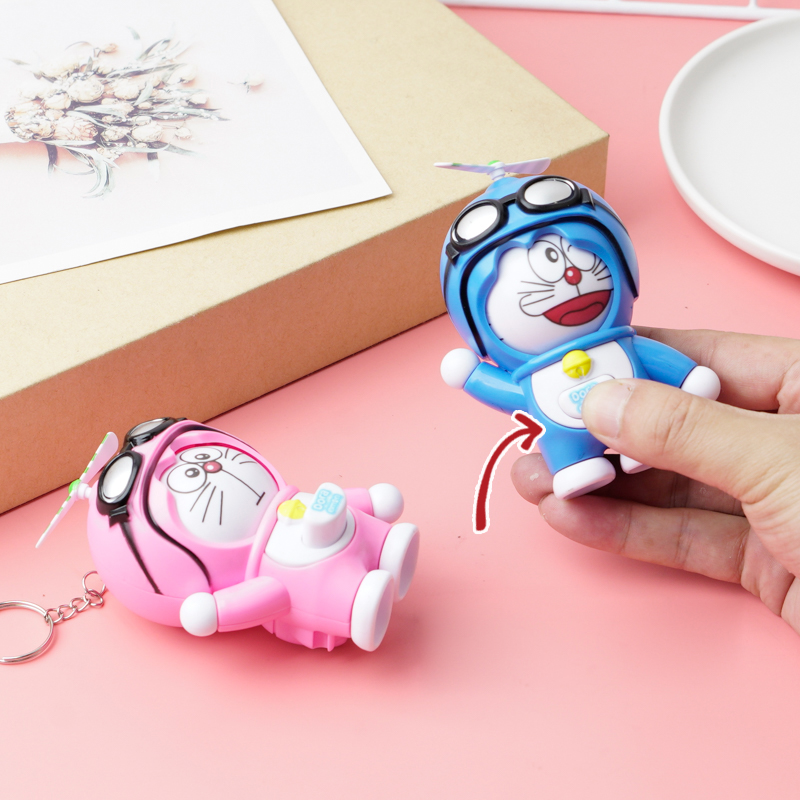 Doraemon press to change face doll pendant