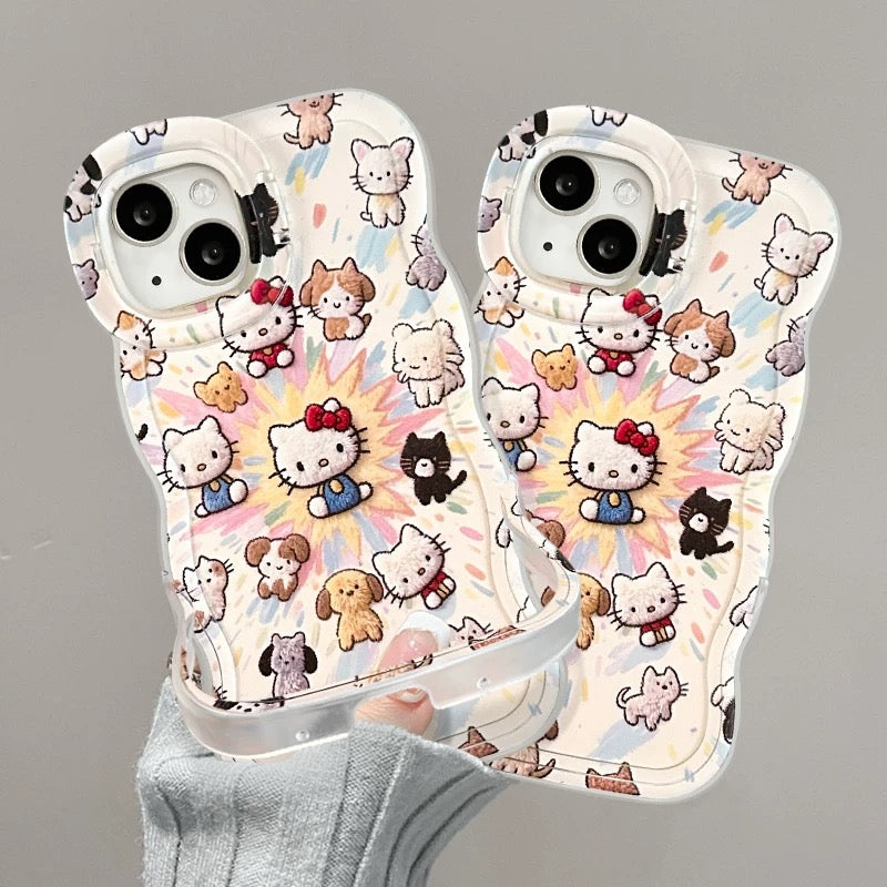 Kattunge och valp med dubbla stativ för mobilen