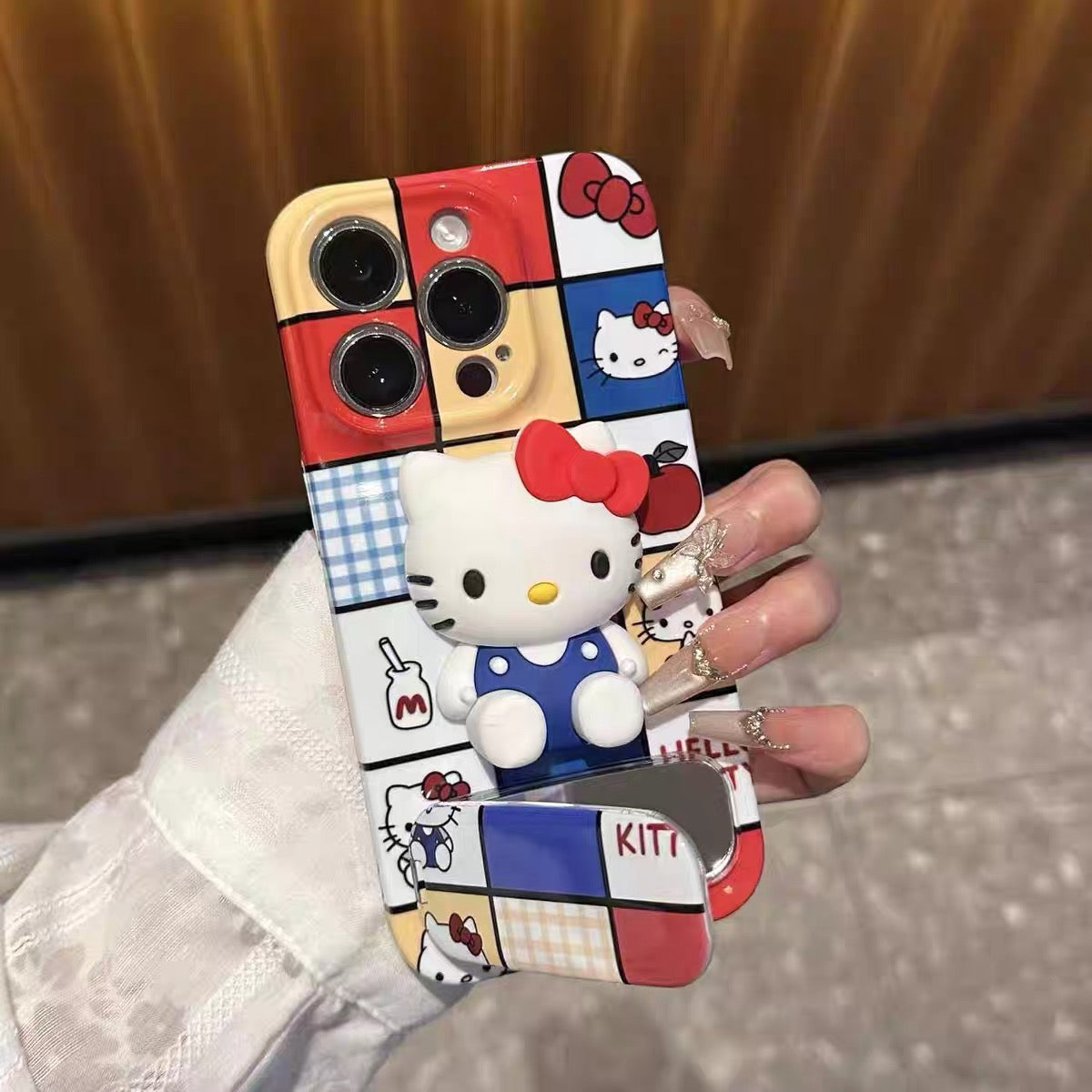 Hello Kitty mirror phone case with a stand and grid pattern