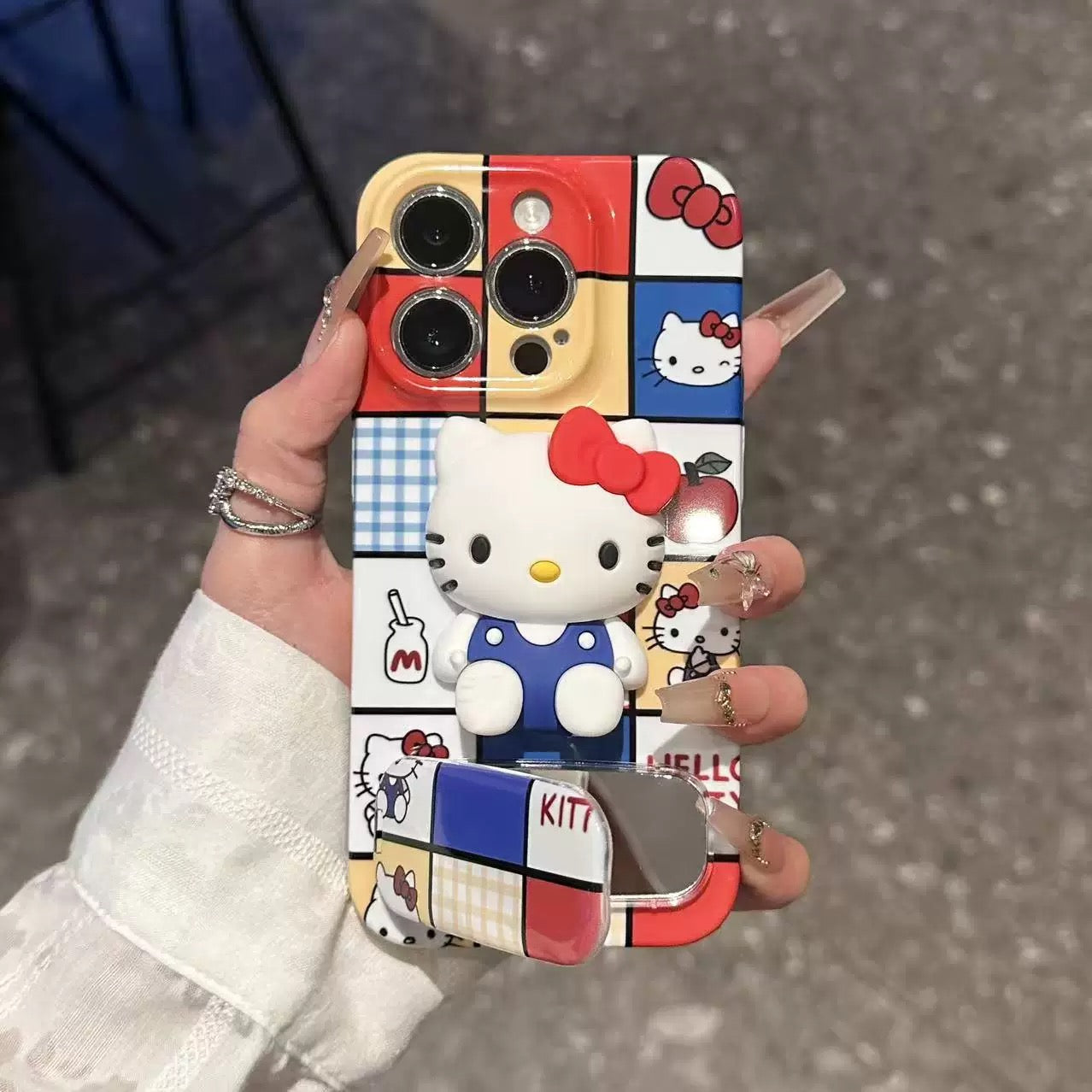 Hello Kitty mirror phone case with a stand and grid pattern