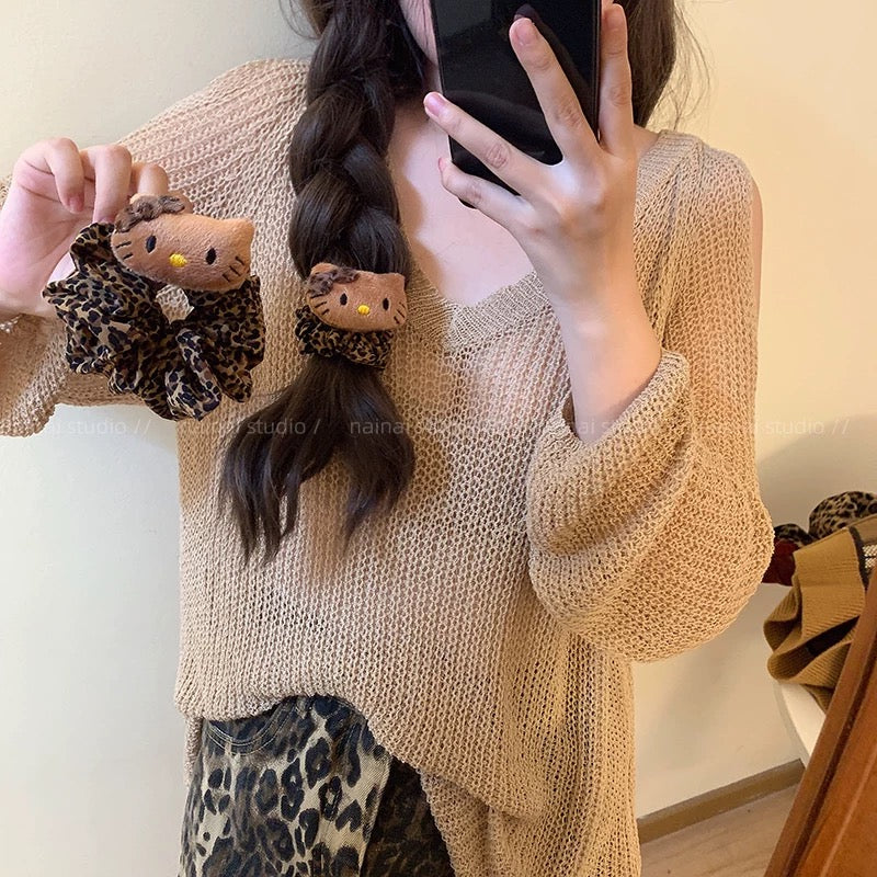 Leopard-print Hello Kitty scrunchie hair accessory