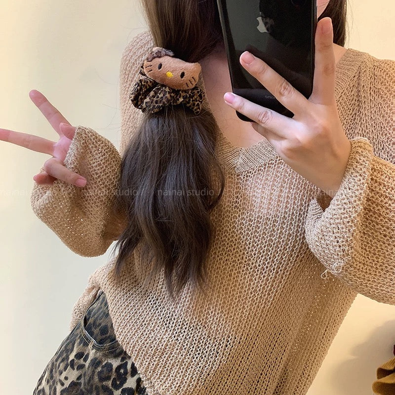 Leopard-print Hello Kitty scrunchie hair accessory