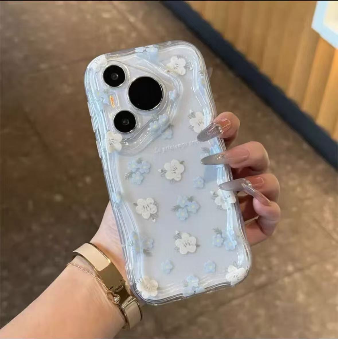 Blue and white floral phone case with a stand
