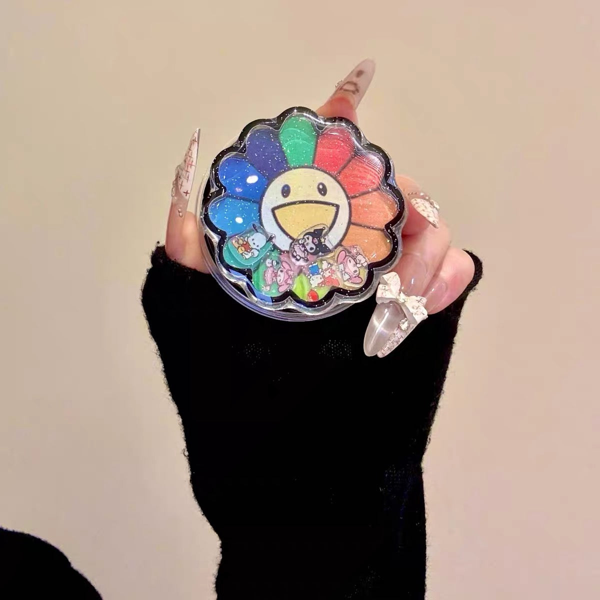 2-in-1 Sanrio-themed magnetic sta2-in-1 Sanrio-themed magnetic stand phone case with a colorful sunflower shaker charm.nd phone case with a colorful sunflower shaker charm.