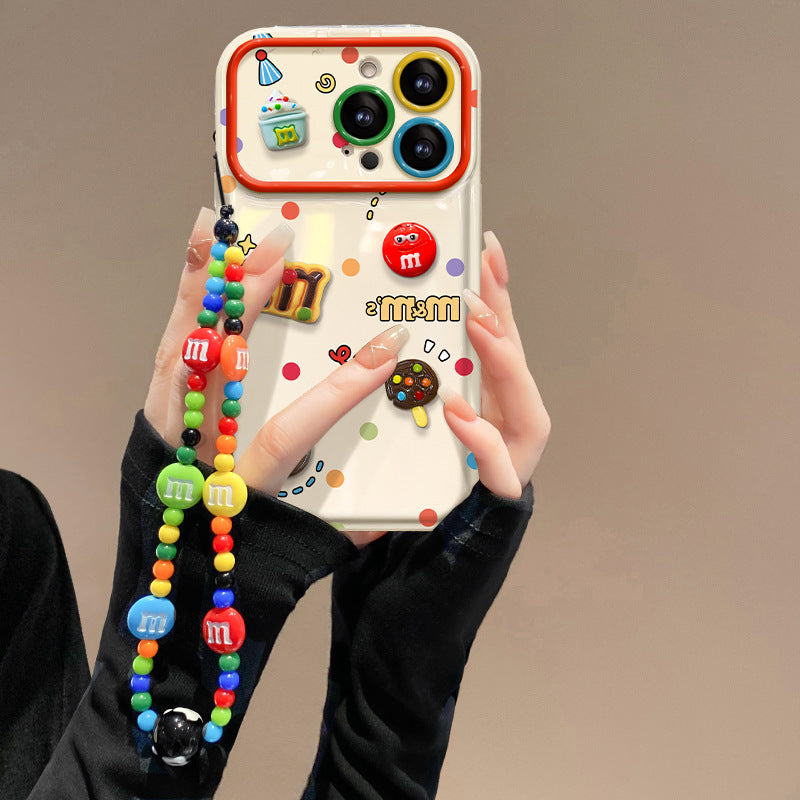 Polka-dot M&M character phone case with a flip-out mirror and wrist strap.