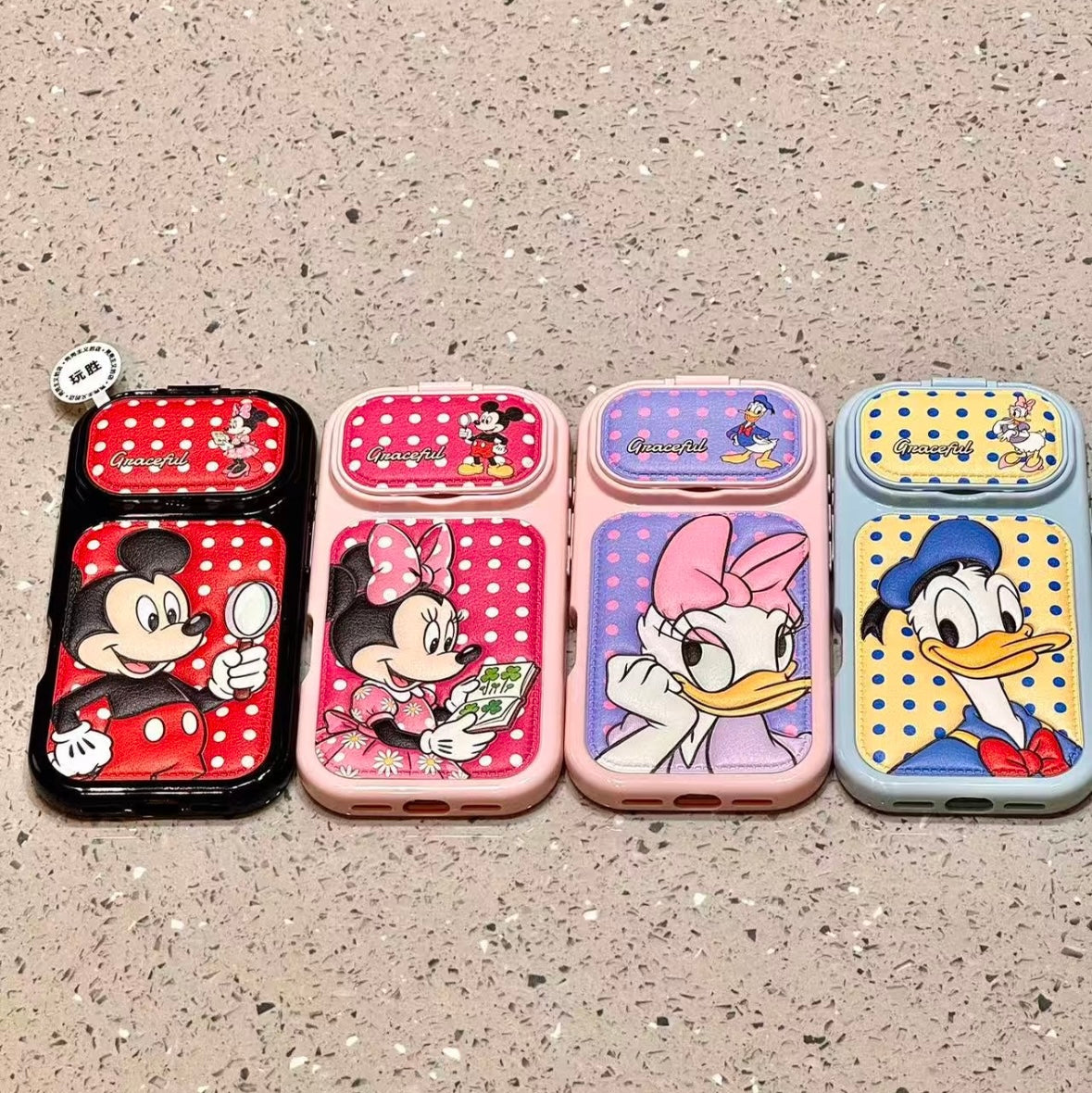 Flip-style mirror phone case featuring Mickey, Minnie, Donald, and Daisy Duck.
