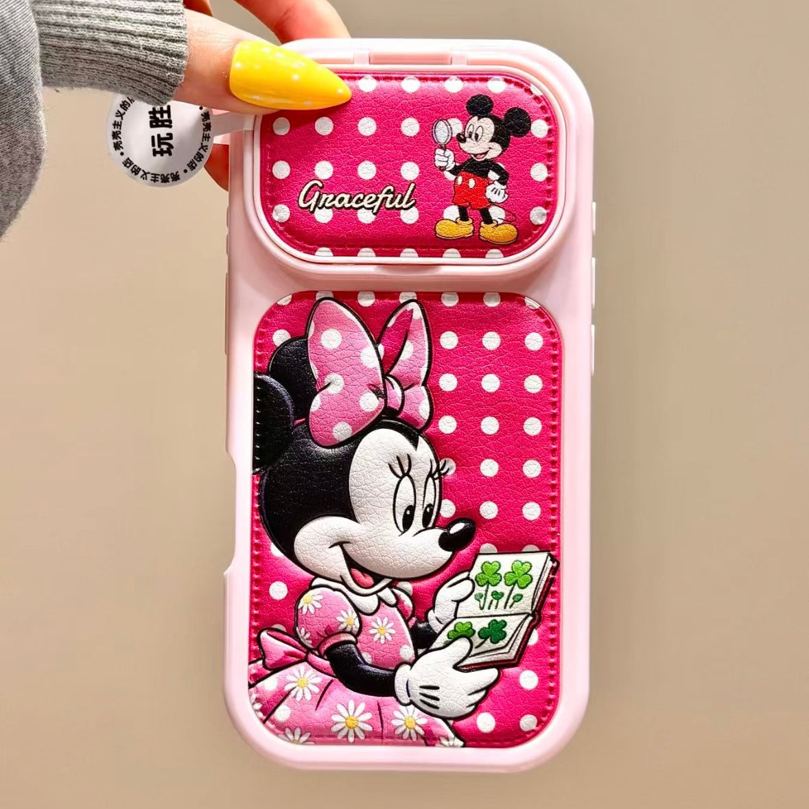 Flip-style mirror phone case featuring Mickey, Minnie, Donald, and Daisy Duck.