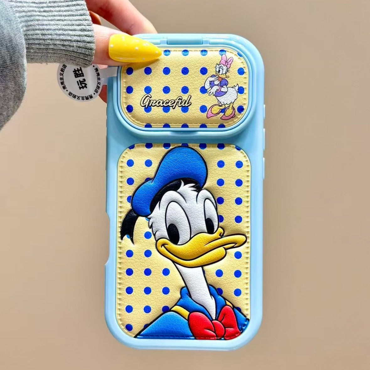Flip-style mirror phone case featuring Mickey, Minnie, Donald, and Daisy Duck.