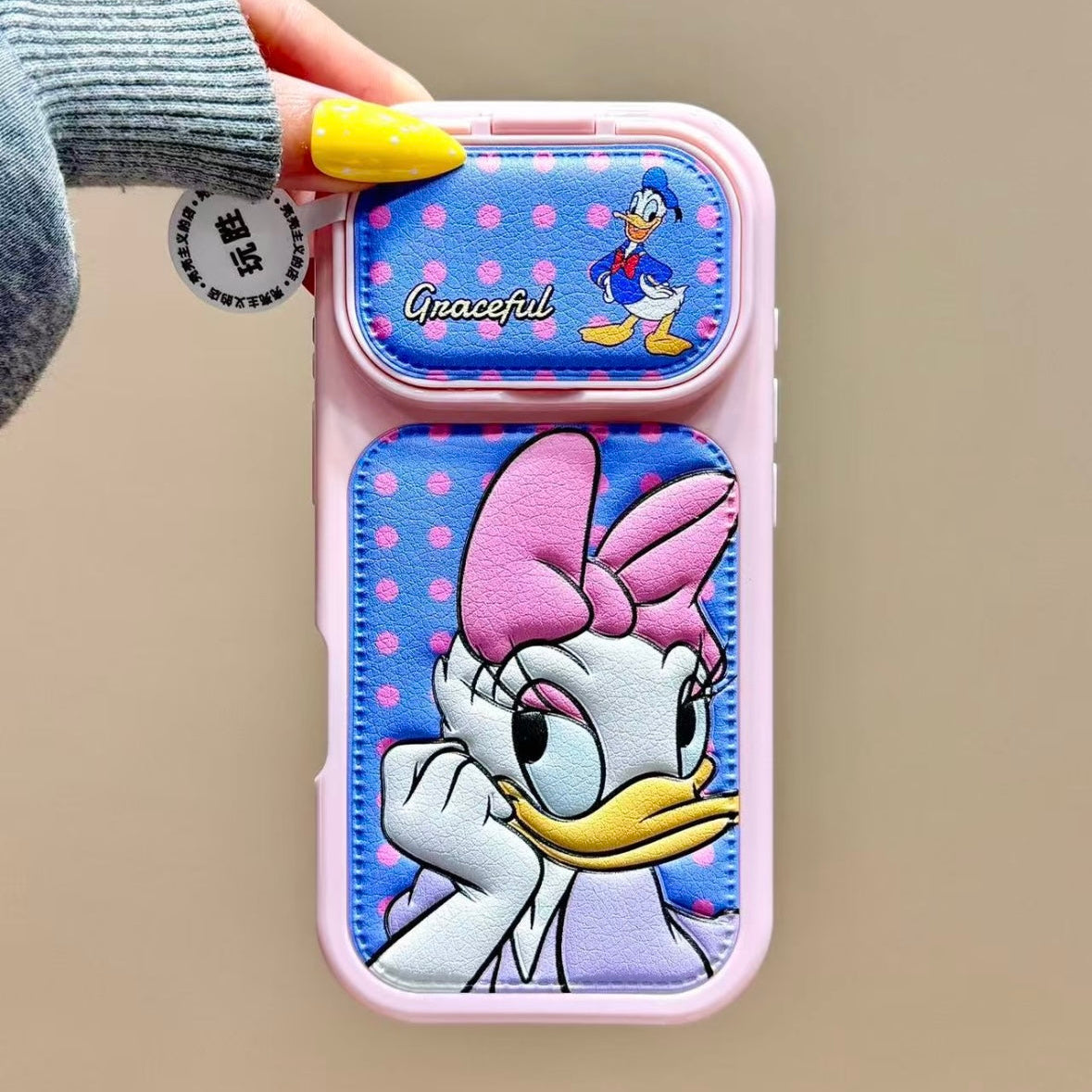 Flip-style mirror phone case featuring Mickey, Minnie, Donald, and Daisy Duck.