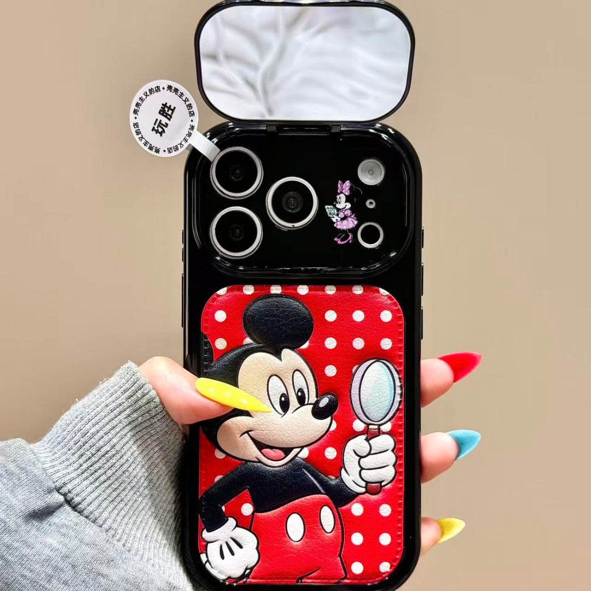 Flip-style mirror phone case featuring Mickey, Minnie, Donald, and Daisy Duck.