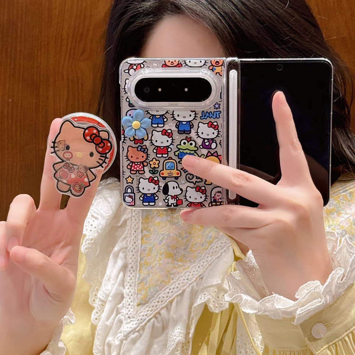 Full-screen Hello Kitty magnetic foldable phone case with a shaker element.