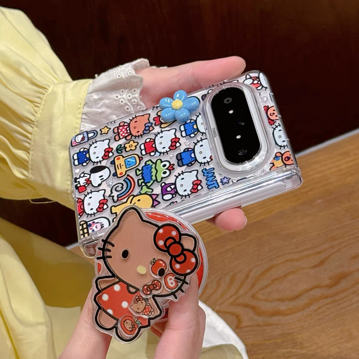 Full-screen Hello Kitty magnetic foldable phone case with a shaker element.