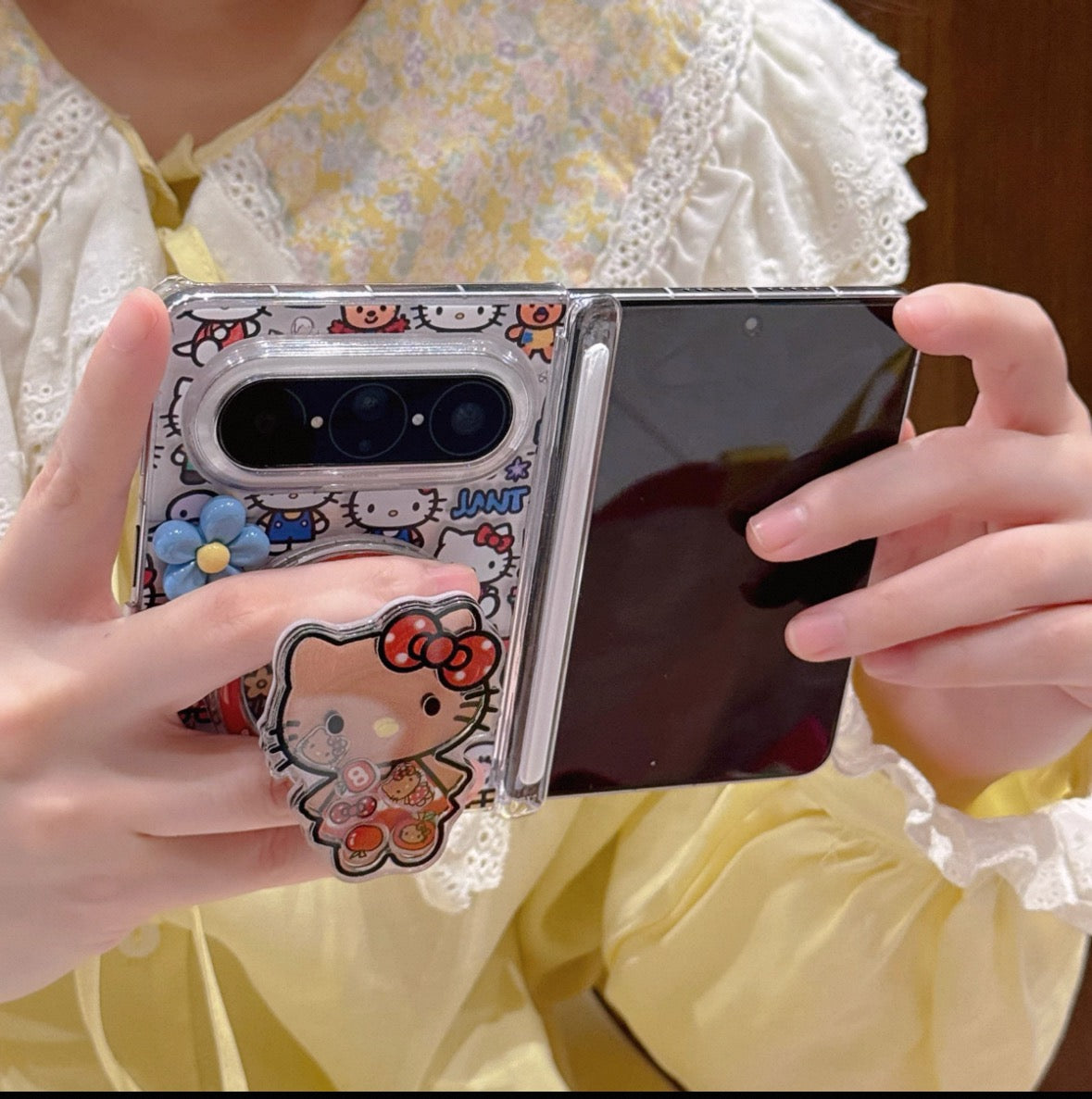 Full-screen Hello Kitty magnetic foldable phone case with a shaker element.