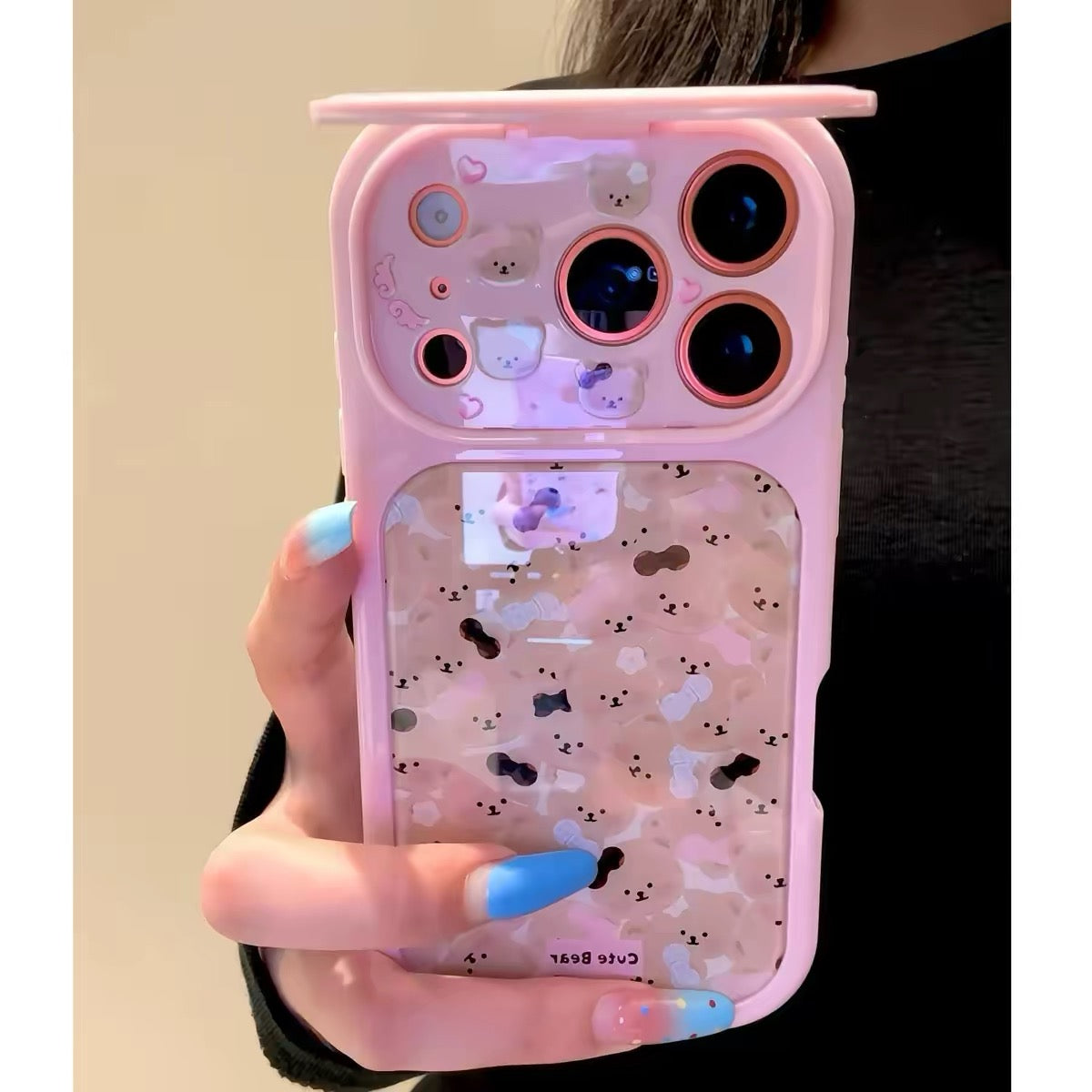Flip-mirror phone case featuring a pink bow and an all-over teddy bear pattern.