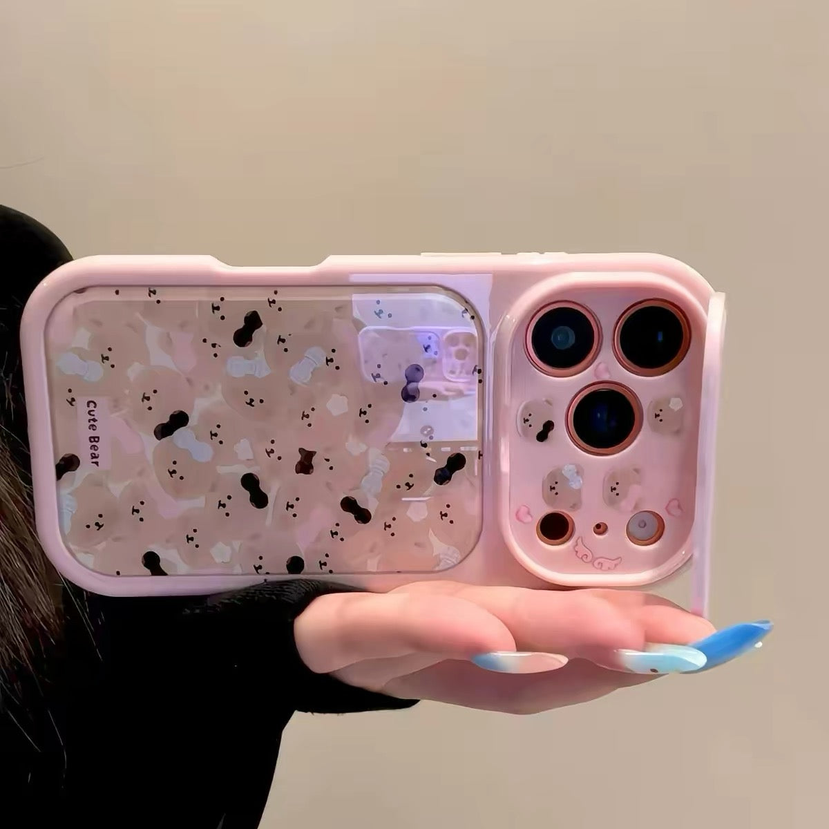 Flip-mirror phone case featuring a pink bow and an all-over teddy bear pattern.