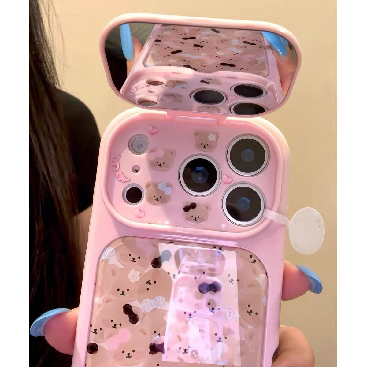 Flip-mirror phone case featuring a pink bow and an all-over teddy bear pattern.