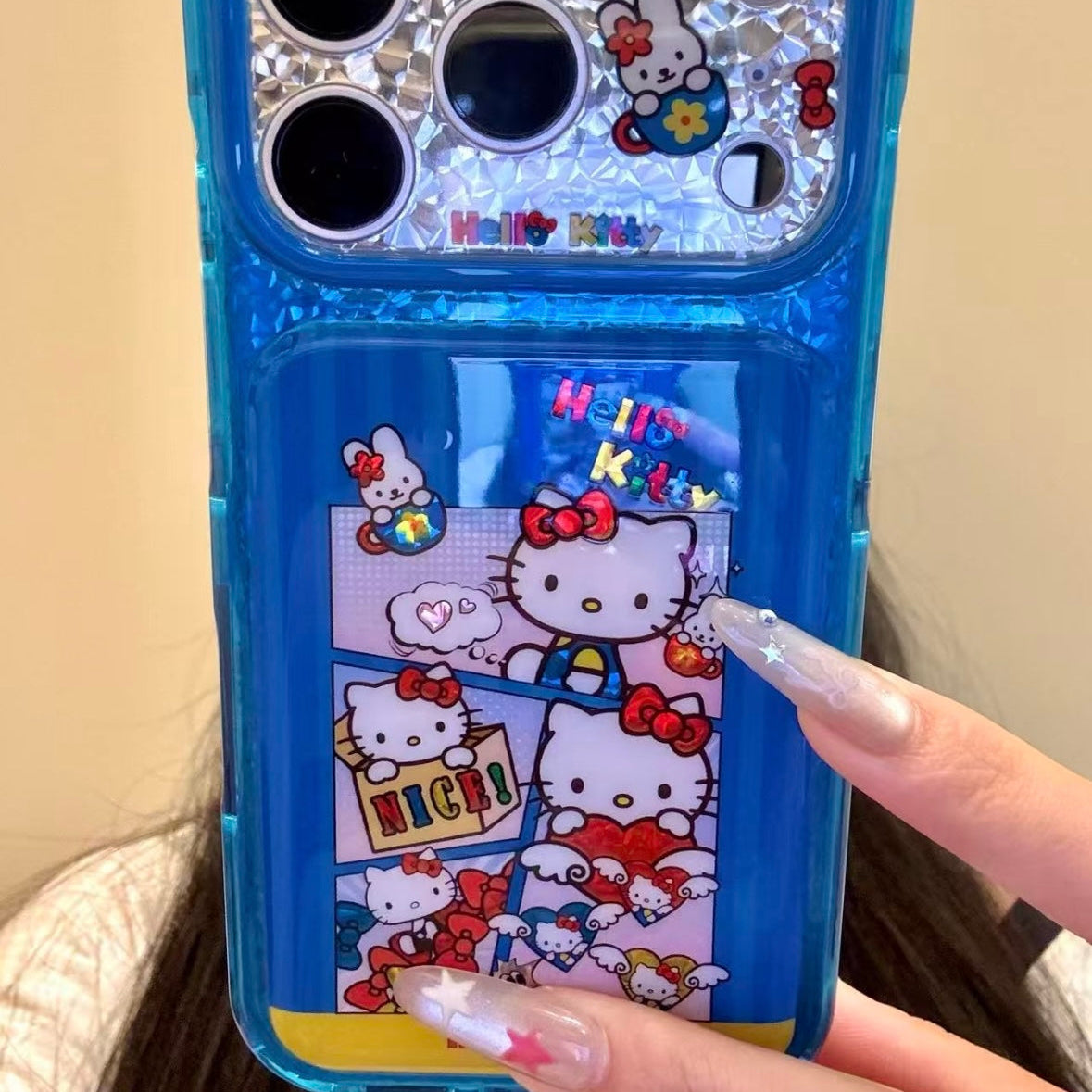 Cartoon Hello Kitty phone case featuring a bow, wings, and a red heart.
