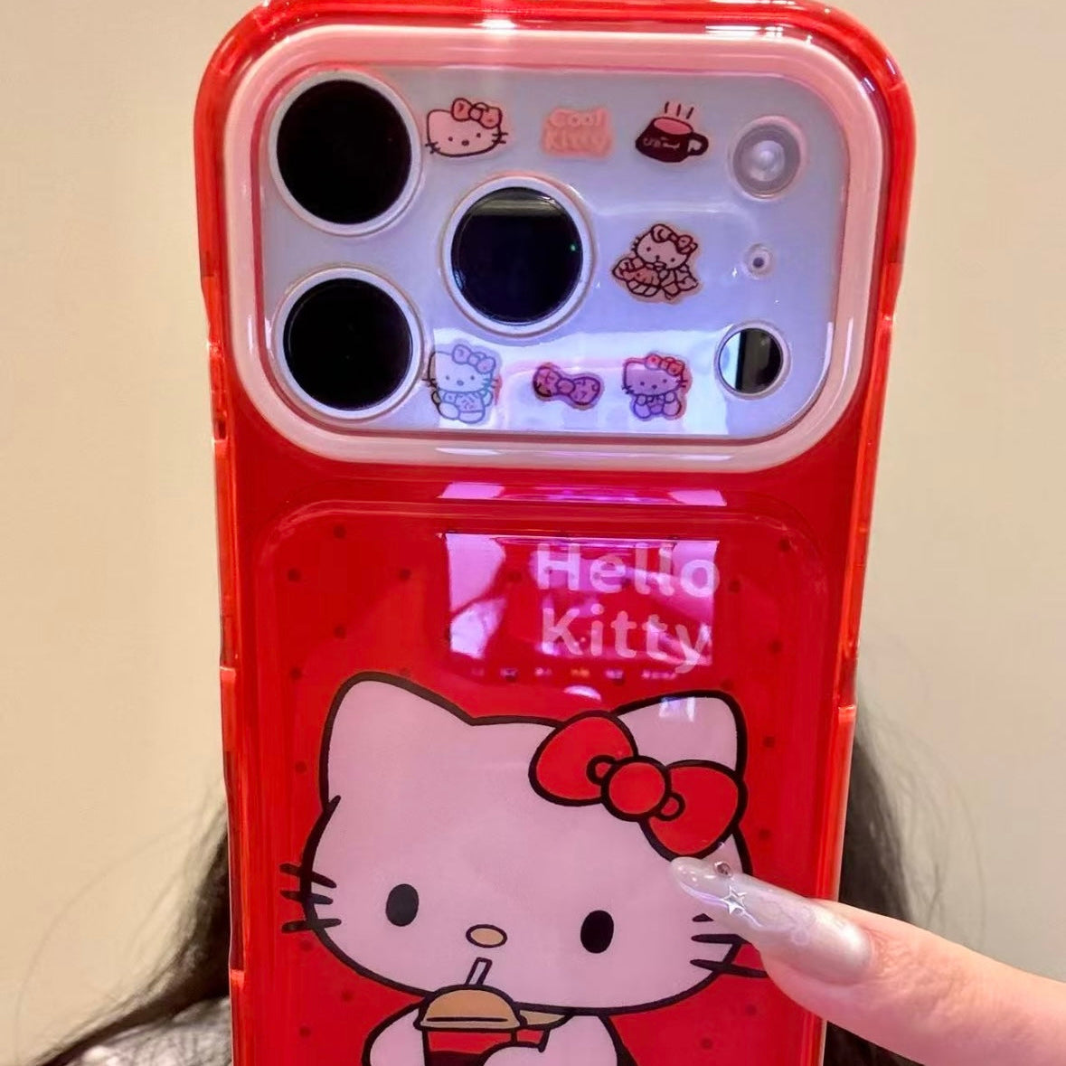 Cartoon Hello Kitty phone case featuring a bow, wings, and a red heart.