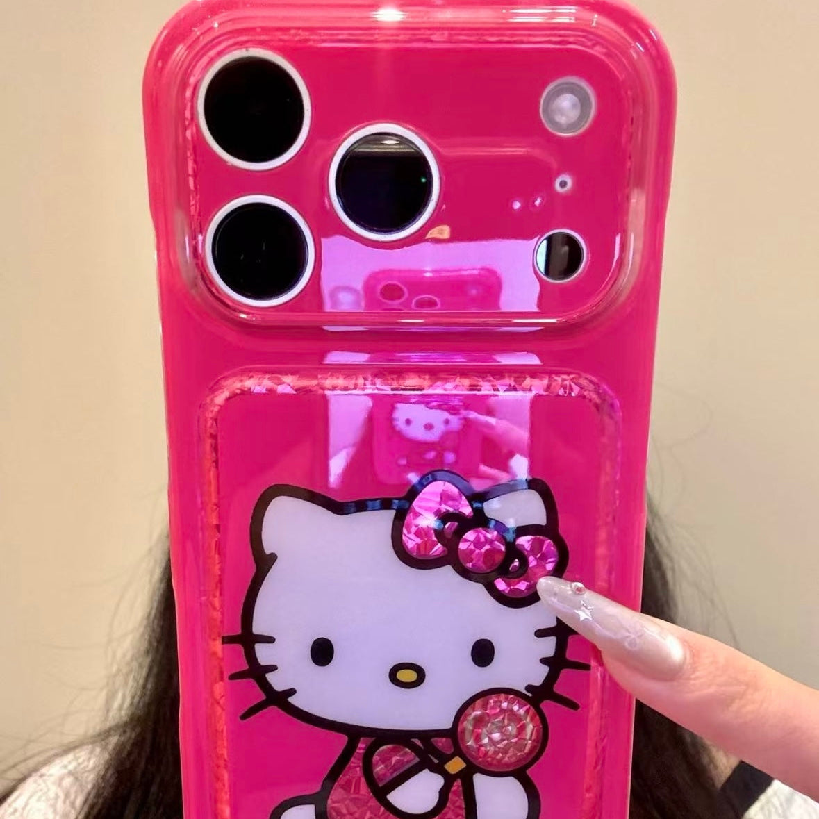 Cartoon Hello Kitty phone case featuring a bow, wings, and a red heart.