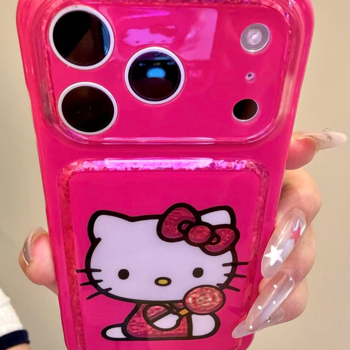 Cartoon Hello Kitty phone case featuring a bow, wings, and a red heart.