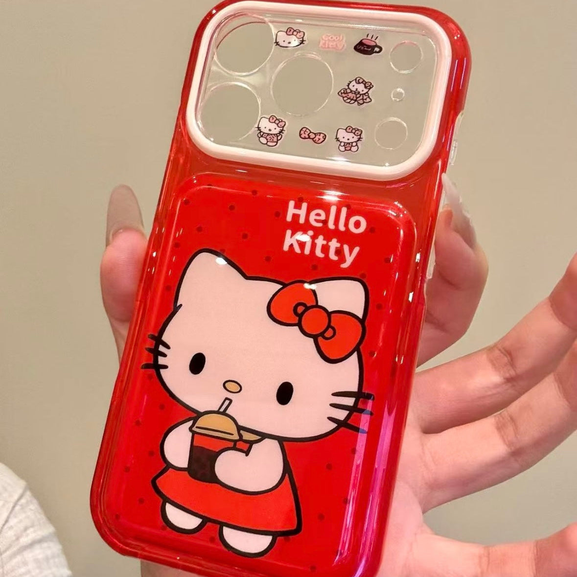 Cartoon Hello Kitty phone case featuring a bow, wings, and a red heart.