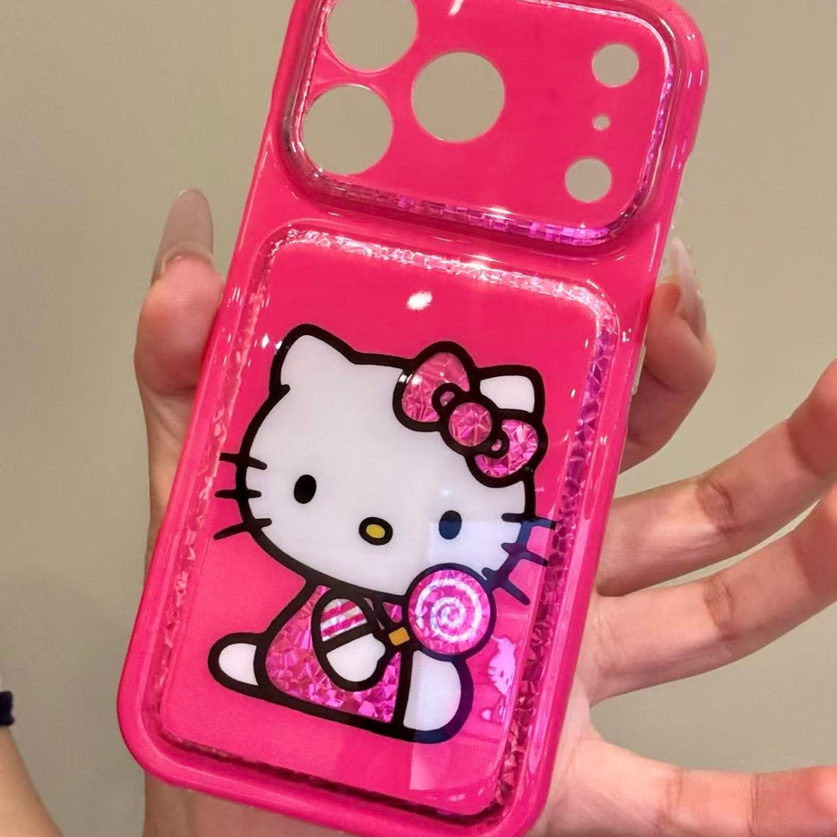 Cartoon Hello Kitty phone case featuring a bow, wings, and a red heart.