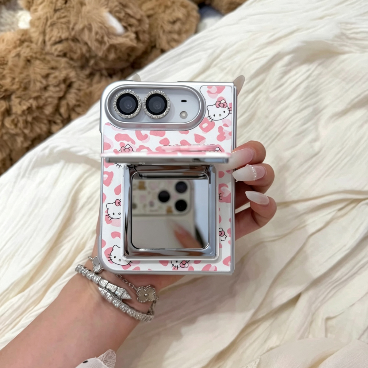 Premium-style foldable phone case featuring a leopard print, rhinestone accents, and a cat-shaped mirror.