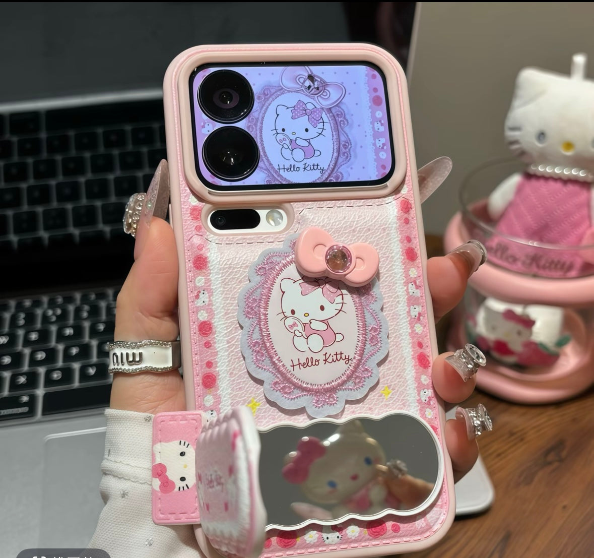 Phone case with lace bow embroidery, Hello Kitty design, and mirror stand.