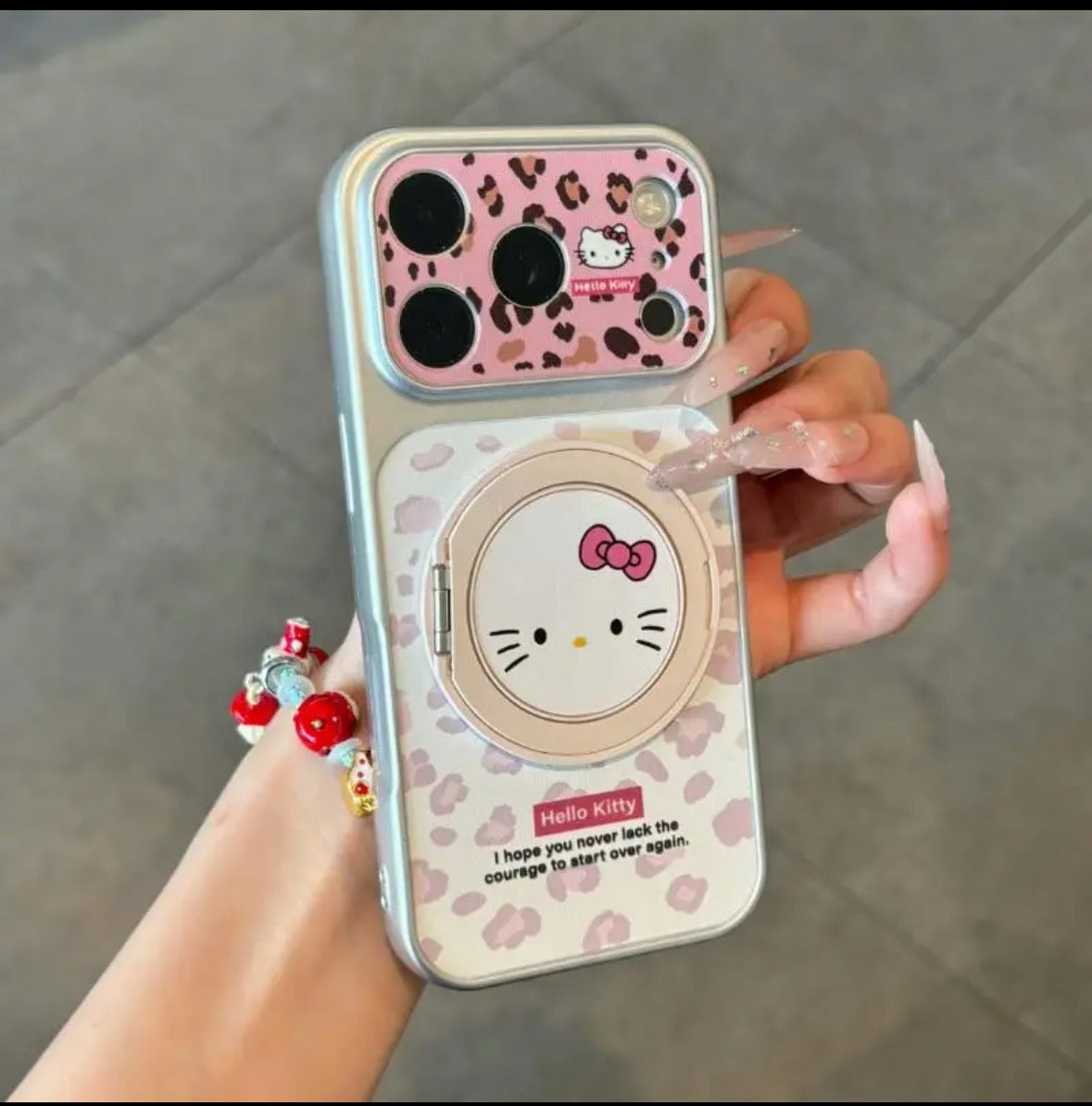 Leopard-print Hello Kitty phone case with a rotating stand