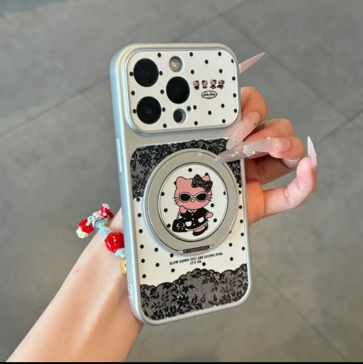 Leopard-print Hello Kitty phone case with a rotating stand