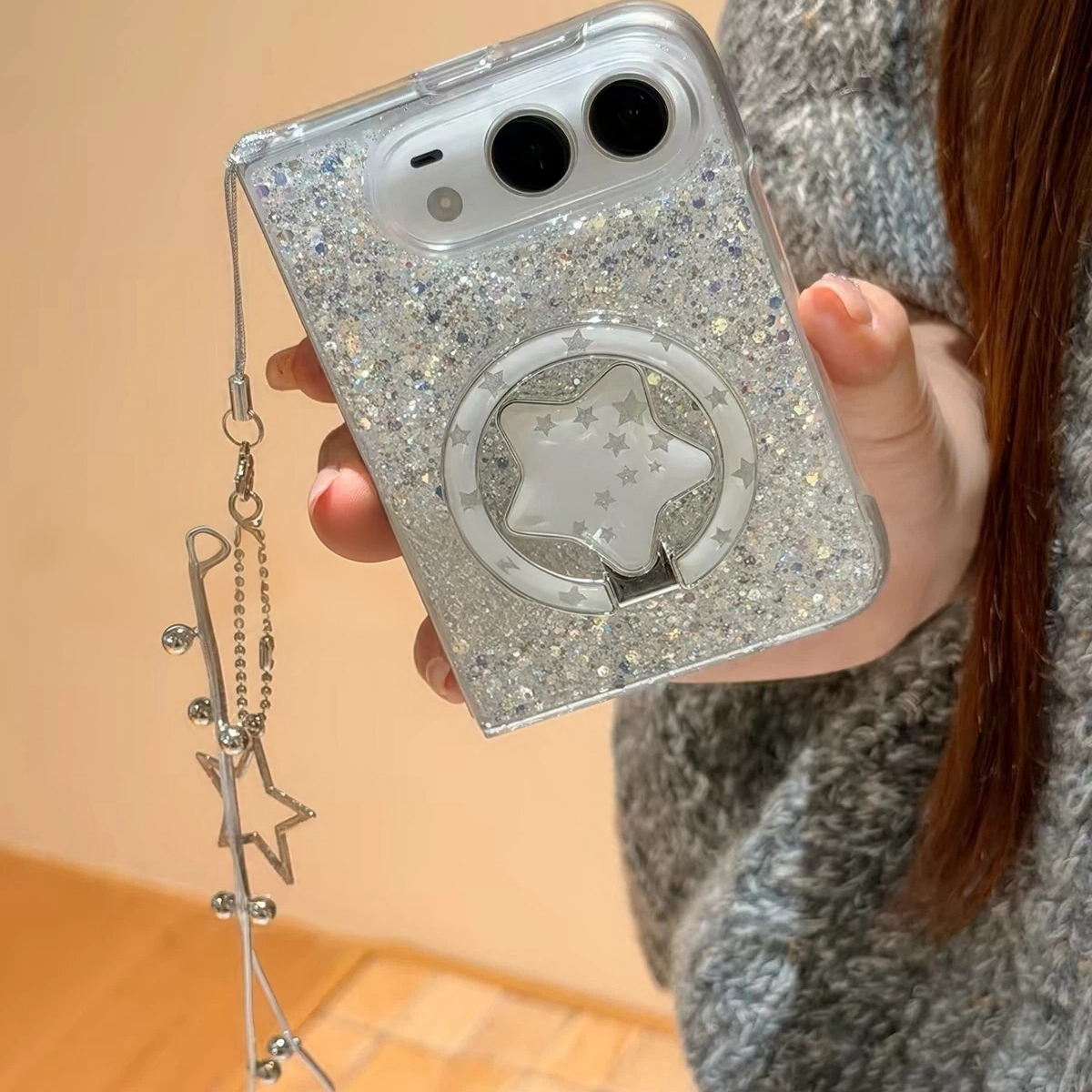 Dreamy silver-glitter star-themed phone cases, available for iPhone Duo and Android foldable phones.